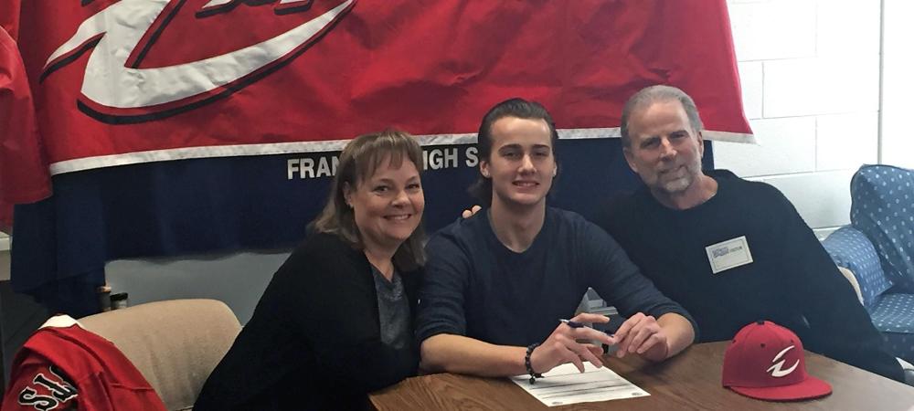 Adrian Reed is joined by his parents on signing day. Photo by Owens Sports Information