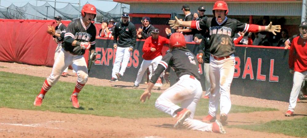 Owens players celebrate a run in today's first game. Photo by Nicholas Huenefeld/Owens Sports Information