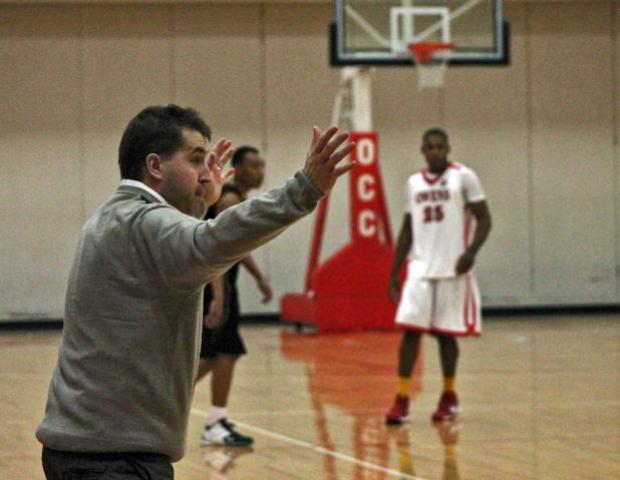 Express men's basketball head coach Dave Clarke shows his emotions following a call in today's 75-58 loss to Glen Oaks. Photo by Kyle Wilber/Owens Sports Information
