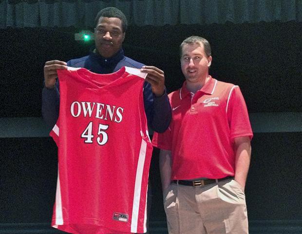 Antoine Bedford poses with Express head men's basketball coach Dave Clarke. The 6'6" forward recently became the first member of the 2013-14 Express men's basketball freshmen class. Photo by Owens Sports Information