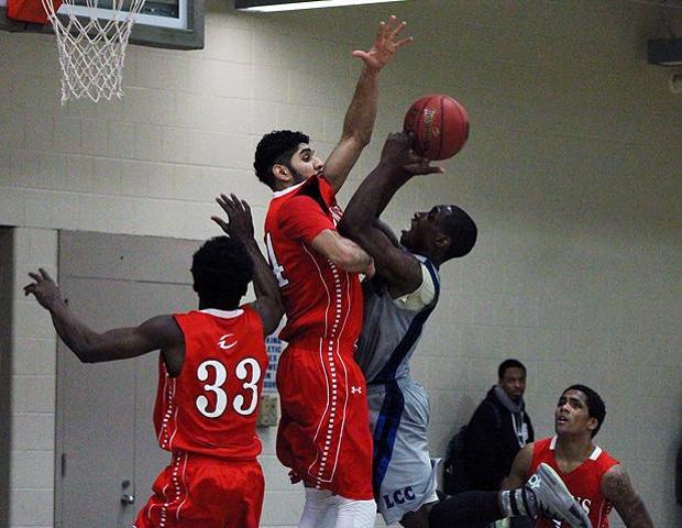 Lakeland's Marcus Fleming is met by Bikramjit Gill in today's game, which the Express won 76-72. Photo by Nicholas Huenefeld/Owens Sports Information