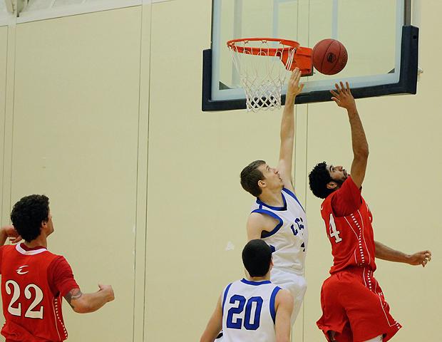 Bikramjit Gill scored over a Lorain County defender. He had 15 points on 6-for-8 shooting in the 118-79 win. Photo by Nicholas Huenefeld/Owens Sports Information