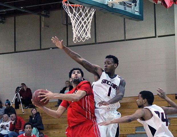 Bikramjit Gill goes up for a basket in the second half of today's 104-99 win over Sinclair. The sophomore had 20 points, 15 rebounds and three blocks. Photo by Geoff Roberts/Owens Sports Information