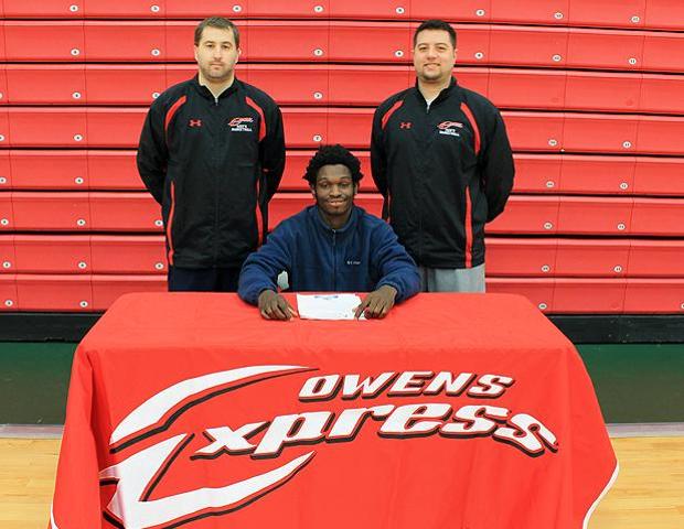 Tony Boykins, pictured here with Owens men's basketball coaches Dave Clarke and Keith Raine, signed with NCAA Division II school Gannon University recently. Photo by Nicholas Huenefeld/Owens Sports Information