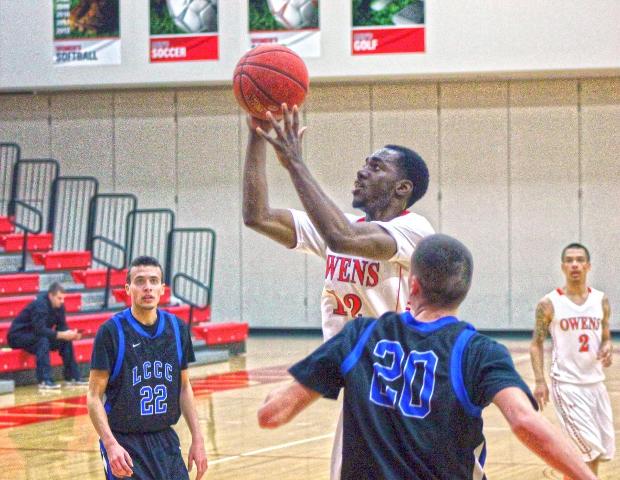 CJ Bussey attempts a shot in the paint during tonight's 121-76 win over Lorain County. The sophomore guard had a season-high 21 points off the bench. Photo by Tobias Flemming/Owens Sports Information