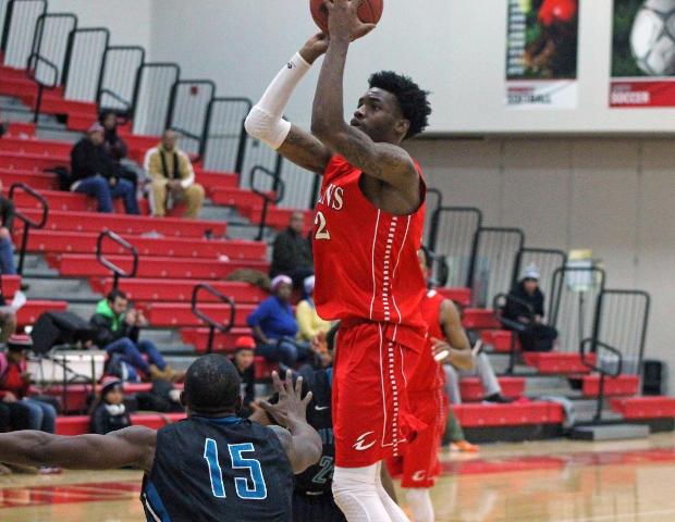 Kenny Jones attempts a jumper in the paint during the second half of tonight's 90-88 overtime win over Cuyahoga. It was Jones who hit the game-winning basket with 3.2 seconds left in overtime. Photo by Tobias Flemming/Owens Sports Information
