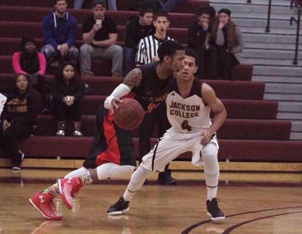 John Murry drives past Jackson's Myles Lockridge in the second half tonight. The sophomore guard finished with a career-high 34 points and a team-high eight rebounds. Photo by Nicholas Huenefeld/Owens Sports Information