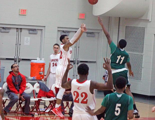 John Murry, pictured here attempting a 3-pointer earlier this year, was named the OCCAC player of the week for his 27 point, 15 rebound game against Sinclair on Saturday. Photo by Nicholas Huenefeld/Owens Sports Information