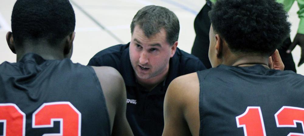 Owens head coach Dave Clarke is pictured here talking to his team during a timeout. Photo by Nicholas Huenefeld/Owens Sports Information