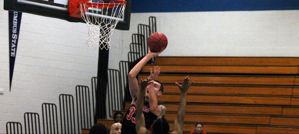 Dilyn Good attempts a shot in the paint against Cuyahoga in tonight's 85-81 OT loss. Photo by Nicholas Huenefeld/Owens Sports Information
