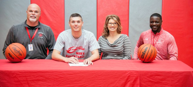 Ben German, second from left, signed with Owens recently. He is joined by Owens head coach Dennis Springs (far right), along with his parents Mark and Michelle. Photo provided to Owens Sports Information