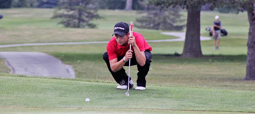Wyatt Spalding eyes up a putt.