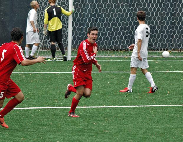 Chris Kervick celebrates his goal early in the second half that pulled the No. 15 Express within one. Photo by Nicholas Huenefeld/Owens Sports Information