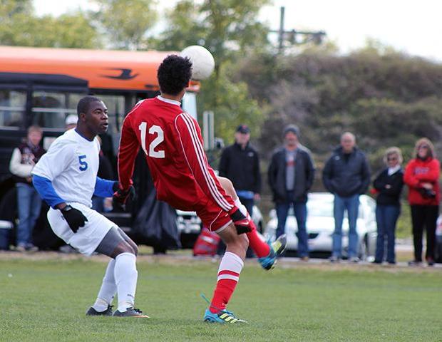 Ahmad Jarrar looks to play a ball past an Ancilla defender in today's 2-0 Express win. Photo by Nicholas Huenefeld/Owens Sports Information
