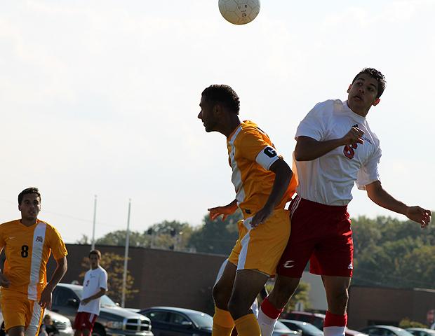 Agustin Bonjour (6) battles for a ball in the air against a Schoolcraft defender in today's matchup. Photo by Nicholas Huenefeld/Owens Sports Information