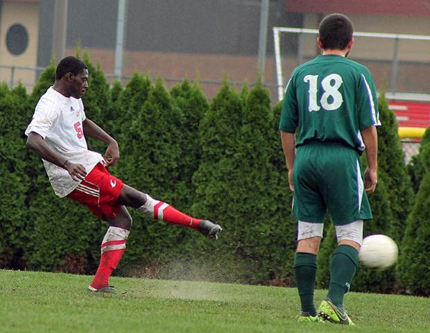 Troy Watson delivers the ball on a penalty kick for his first career goal in today's 4-0 win over Mercyhurst North East. Photo by Nicholas Huenefeld/Owens Sports Information