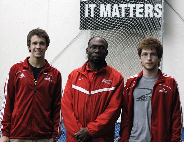 Express head men's soccer coach Art Johnson poses with two of his signees for next season, Ben Rubin and Sam Miller. Both players are defenders from Sylvania Northview High School. Photo by Nicholas Huenefeld/Owens Sports Information