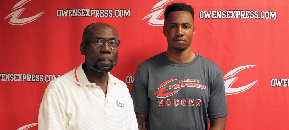 Maxwell Ejiogu, right, is pictured here with Owens men's soccer head coach Art Johnson. Photo by Nicholas Huenefeld/Owens Sports Information
