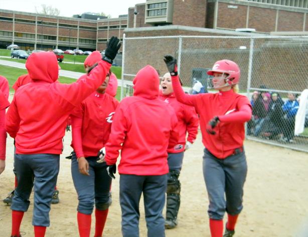 Tabitha Britt is congratulated at home after her grand slam in the second game against Lakeland. Her teammate, Sydney Barron, would follow her grand slam with a solo shot to make it back-to-back homers for the Express. Photo by Nicholas Huenefeld/Owens Sports Information