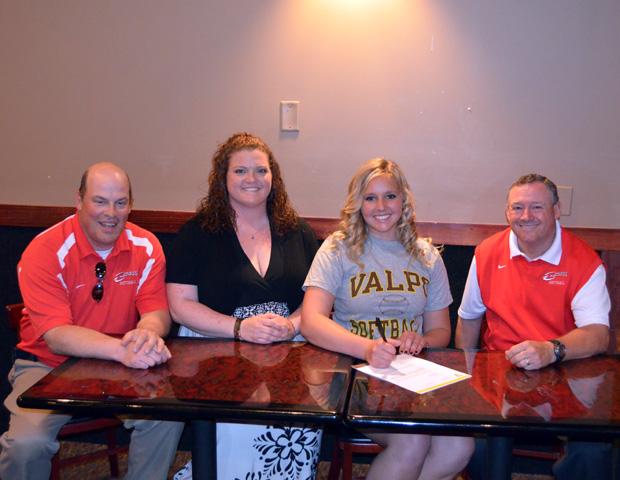 Ashlyn Michalak (second from right) signs her letter of intent to play softball for Valparaiso University next year. She is surrounded by Express softball head coach Duane Lanham (far right), and Express assistant coaches Kevin Snyder (far left) and Sara Fleming (second from left). Photo courtesy of Nicholas Huenefeld/Owens Sports Information