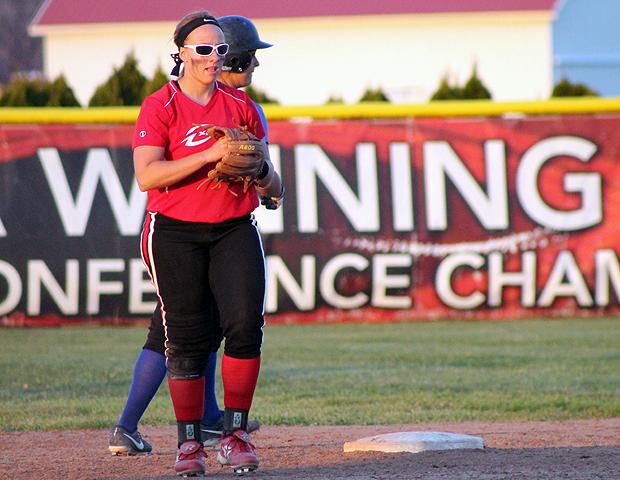 Brittany George holds the ball after securing the final out on a flip from second baseman Kimberly Jesse. With today's sweep, the Express won the OCCAC championship. Photo by Geoff Roberts/Owens Sports Information