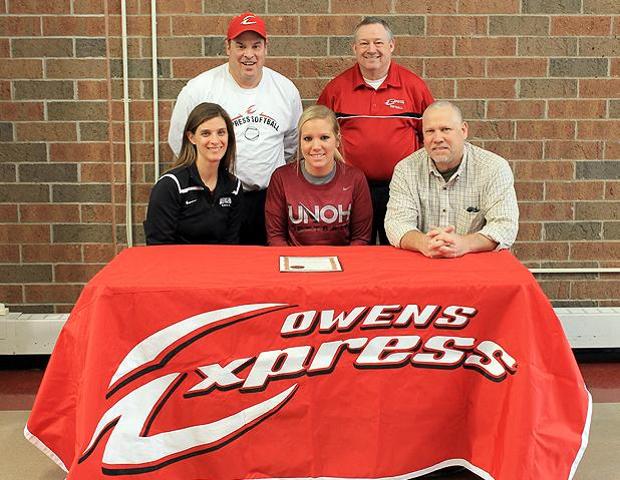 Emily Rockman is joined by family and coaches after signing her letter of intent to play at UNOH. Pictured are her father Mike Rockman, front right, UNOH softball head coach Tracy Coffman (front left), Express softball assistant coach Kevin Snyder (back left) and Express softball head coach Duane Lanham (back right). Photo by Nicholas Huenefeld/Owens Sports Information