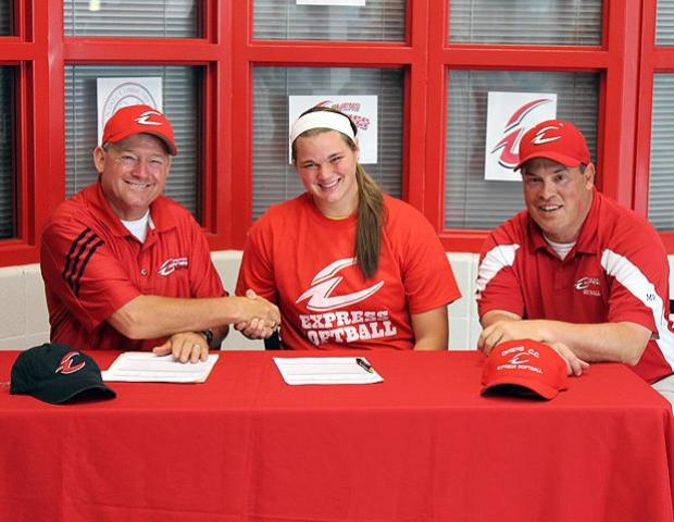 Tori Weidinger and Express softball head coach Duane Lanham shake hands after Weidinger signed her letter of intent to play for the Express. To Weidinger's left is Express softball assistant coach Kevin Snyder. Photo by Nicholas Huenefeld/Owens Sports Information