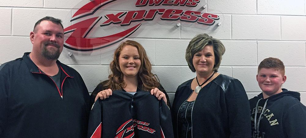 Banister is joined by her family on signing day. Photo by Owens Sports Information