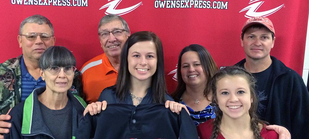 Kayleen England is surrounded by her family on signing day. Photo by Owens Sports Information