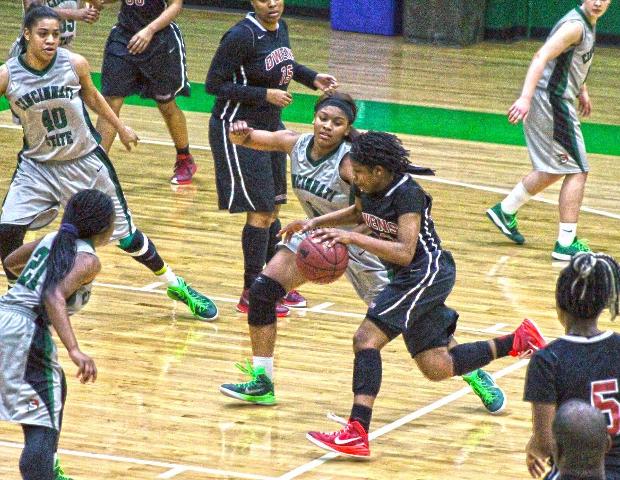 Sierra Harley, pictured here driving against Cincinnati State's Jada Jackson in the first half, produced her first career triple-double in today's win. Photo by Nicholas Huenefeld/Owens Sports Information