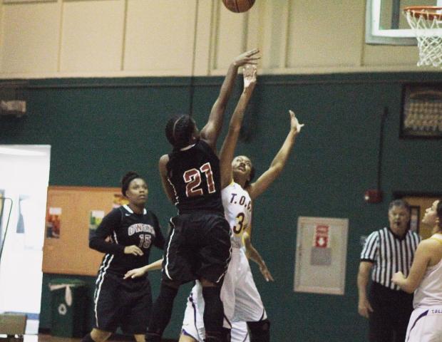 Kheri Motley attempts a jumper in the paint in today's 74-48 win over Tohono O'odham Community College. Photo by Nicholas Huenefeld/Owens Sports Information