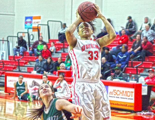 Ashley Tunstall scores over Cincinnati State's Michayla Barga in the second half of today's game. Along with Sierra Harley, the sophomore forward had a team-high 17 points. Photo by Tobias Flemming/Owens Sports Information