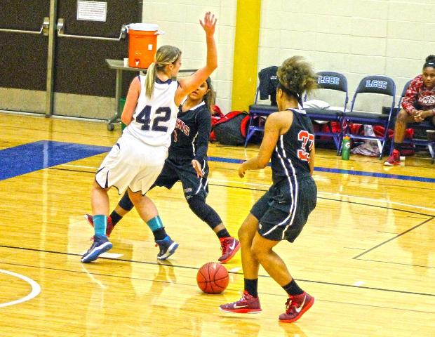 Ashley Tunstall receives a pass from Briana Williams on a fast break in today's win over Lorain County. Photo by Nicholas Huenefeld/Owens Sports Information