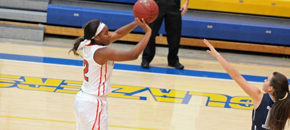 Tatyana Reynolds attempts a 3-pointer during today's win over Olney Central. Photo by Nicholas Huenefeld/Owens Sports Information