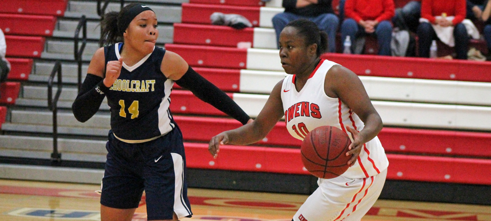 Brenda Pennington looks to make a move past a Schoolcraft defender. Photo by Nicholas Huenefeld/Owens Sports Information