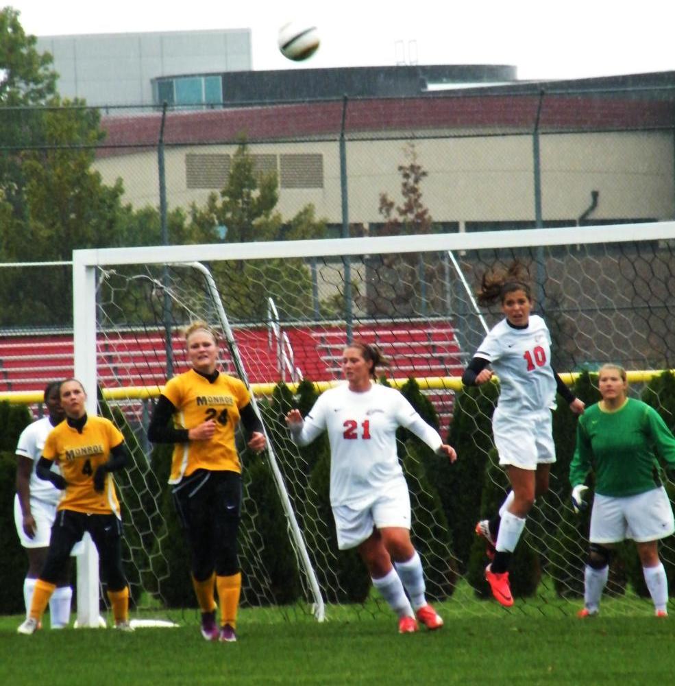 Haley Gasser heads the ball out to safety against Monroe on Sunday. Photo by Nicholas Huenefeld