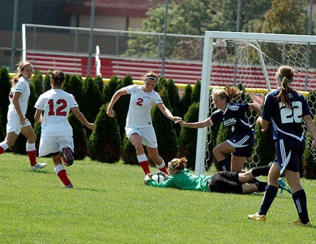 Erika Brinkman corrals a loose ball against Kellogg Community College. The outgoing sophomore has signed with Purdue University Calumet. Photo by Nicholas Huenefeld/Owens Sports Information