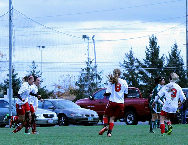 Jessica Grindle and Haley Gasser (left) look to celebrate Grindle's goal in the 61st minute with Taylor Avers (8) and Jill Burkholder (3). Photo by Nicholas Huenefeld/Owens Sports Information
