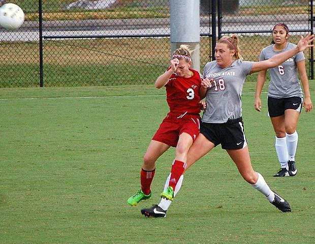 Jill Burkholder battles for control against a Darton State defender in the NJCAA D-I women's soccer national tournament. The sophomore midfielder had the lone penalty kick goal for the Express in a 3-1 PK loss today. Photo by Judy Loehrke/Owens Sports Information