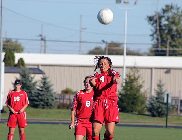 Kendyl Christian, pictured here heading a ball, scored two goals for the Express today in a 5-1 win over Kellogg Community College. Photo by Nicholas Huenefeld/Owens Sports Information