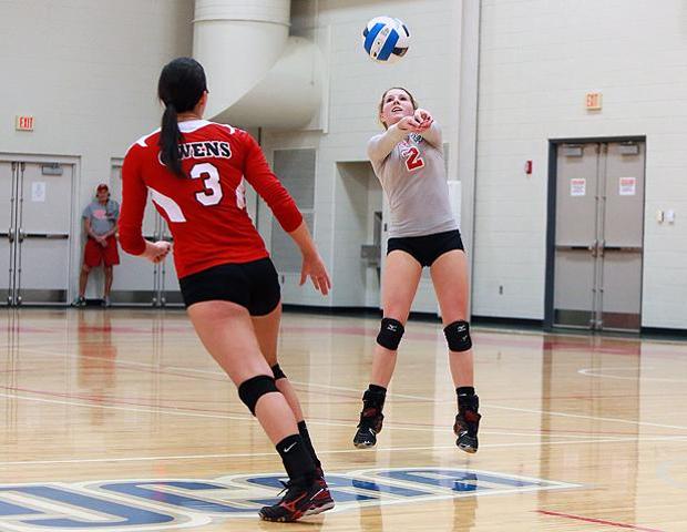 Lisa Urbanski, pictured here setting a ball her freshman year, has signed with Lourdes University to continue her volleyball career. Photo by Frawgbyte Photography