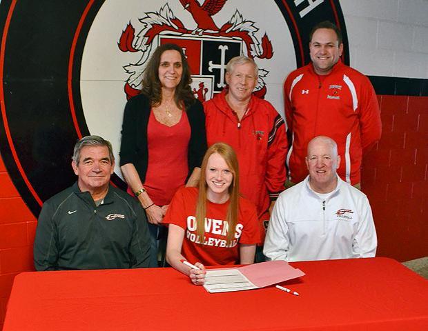 Sara Turner-Smith, front center, signed her letter of intent to play for the Express volleyball team next year. Pictured Seated L-R: Owens Head Coach Sonny Lewis, Turner-Smith, Owens Asst. Coach Denny Caldwell, Standing L-R: Mother Sandy Turner, Father Don Smith, Stritch Head Coach Chad Rutkowski. Photo by Cardinal Stritch High School