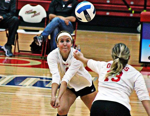 Erika Hartings (left) stretches to dig a ball that is just out of the reach of Deanna Smith. The freshman had a team-high 18 kills in today's win over Lakeland. Photo by Nicholas Huenefeld/Owens Sports Information