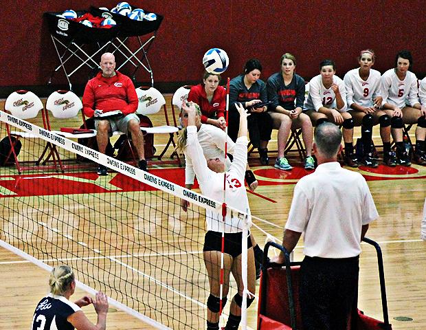 Deanna Smith (13) sets a ball for Taylor Purcell. Photo by Nicholas Huenefeld/Owens Sports Information