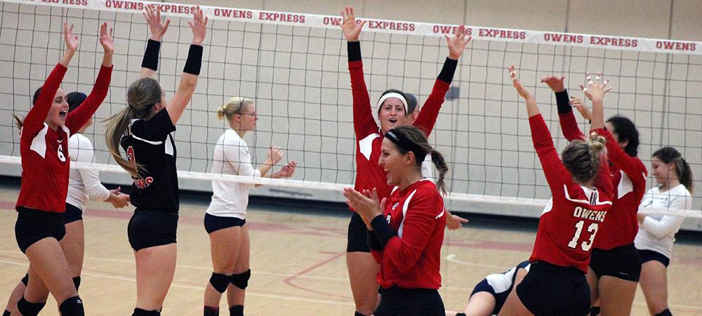 The team celebrates a point during tonight's win over Lorain County. Photo by Nicholas Huenefeld/Owens Sports Information
